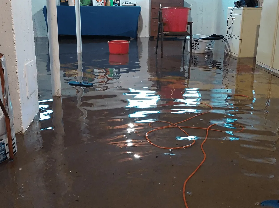 Basement with boiler, cabinets and washing machine completely flooded in Nashua, NH